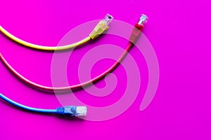 Concept network internet cable on pink background close up