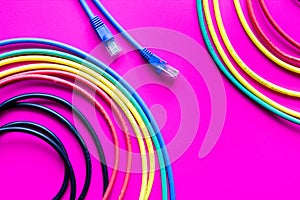 Concept network internet cable on pink background close up