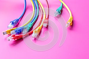 Concept network internet cable on pink background close up