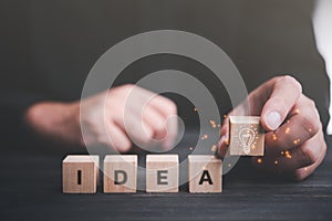 Concept of New idea creativity and inspiration. Icon Light bulb  In the hands of business people Show the word Idea.Creativity can