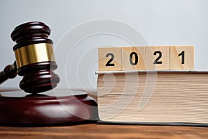 The concept of new laws in 2021 next to the judge hammer