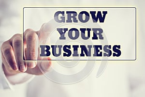 Concept of new or start up business - words Grow your business o