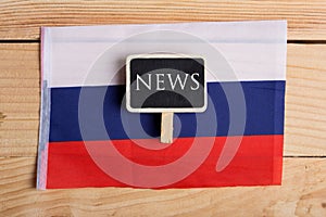 concept news feeds - Breaking news, Russian country& x27;s flag, blackboard and the text News