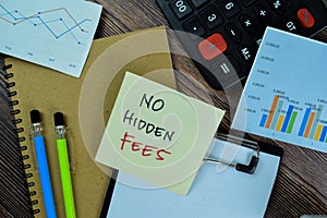 Concept of No Hidden Fees write on sticky notes isolated on Wooden Table