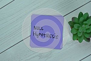 Concept of Null Hypothesis write on sticky notes isolated on Wooden Table