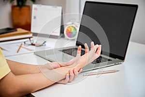 Concept office syndrome hand pain from occupational disease, woman having wrist pain from using computer, wrist pain