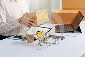 Concept of Online shopping, e-commerce, Woman holding credit card and using laptop computer for shopping online,Businesswoman