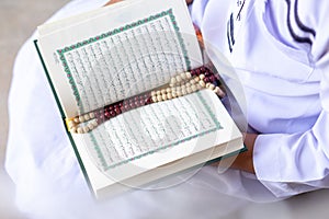 Concept: open book holy prayers for god, Quran - holy book of Muslims religion