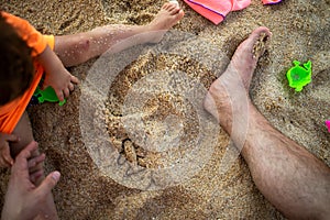 Concept Of Opening Flights Between Countries, end Of Pandemic Quarantine. parent and child play sand on the beach, make