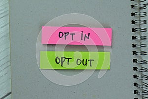Concept of Opt in or Opt Out write on sticky notes isolated on Wooden Table