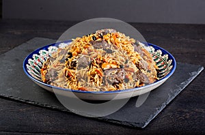 The concept of oriental cuisine. Assorted Uzbek food set, pilaf, samsa