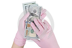 Concept of paid medicine. gloved hands holding a dollars