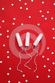 The concept of painkillers during menstruation. Tampons with pills.