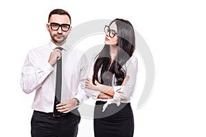 Concept of partnership in business. Young man and woman standing back-to-back with crossed hands against white background