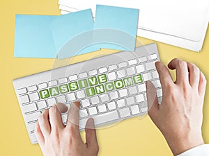 Passive Income concept on green keyboard button.