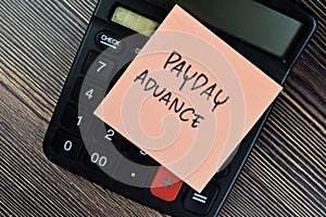 Concept of Payday Advance write on sticky notes isolated on Wooden Table