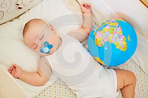 The concept of peace, protection, childhood. Baby boy sleeping