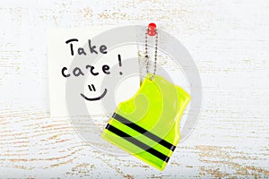 Concept of pedestrain safety. Reflector keychain and label with