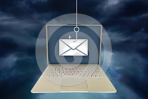 Concept of a phishing attack on a laptop via email to access private information provided by the recipient.