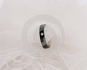 Concept photo of jewelry ring inserted in a roll of cloth.