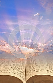 Divine bible scripture spiritual light sun rays clouds sky god christ jesus open book religion religious