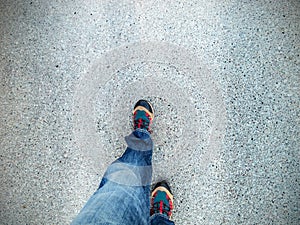 Concept picture of legs walking on asphalt