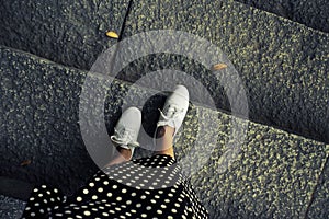 Concept picture of legs walking, vintage toned color image. Self