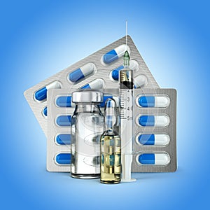 Concept of Pills, vial, ampoule and syringe on blue photo