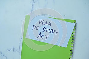 Concept of Plan Do Study Act write on sticky notes isolated on Wooden Table