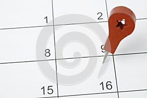 The concept of planning and deadline with push pin on calendar date
