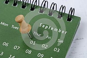 The concept of planning and deadline with push pin on calendar date
