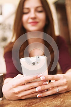 concept portrait of selfie addict young woman photographed themselves with smartphone