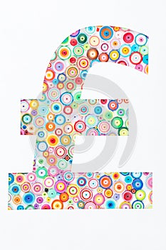 Concept of pound sterling on colorful paper made with quilling t