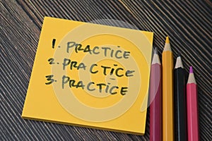 Concept of Pratice, Practice, Practice write on sticky notes isolated on Wooden Table