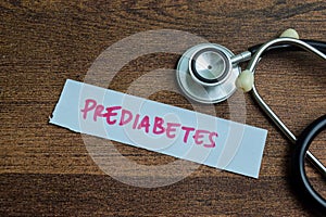 Concept of Prediabetes write on sticky notes isolated on Wooden Table