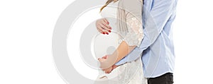 Concept of pregnancy, expecting a baby, love, care - cropped image of young pregnant woman and her husband photo