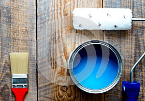 Concept preparation for painting with can of blue paint