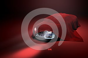 Concept of presentation of the car under a red cloth in a darck red studio 3d rendering Illustration