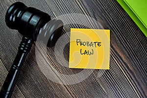 Concept of Probate Law write on sticky notes with gavel isolated on Wooden Table