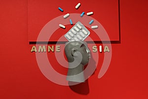 Concept of problems with memory, amnesia disease on red background