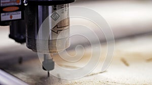 Concept of production and woodworking. Motion. Cutting wood with a CNC milling machine at the factory.