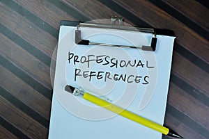 Concept of Professional References write on paperwork isolated on Wooden Table