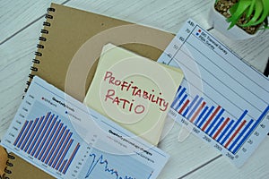 Concept of Profitability Ratio write on sticky notes isolated on Wooden Table