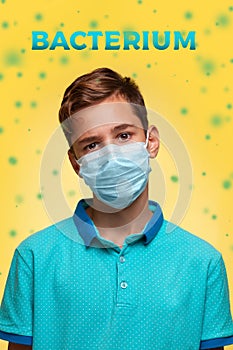 The concept of protection against viruses and diseases. A teenage boy in a blue t-shirt and mask stands on a yellow background