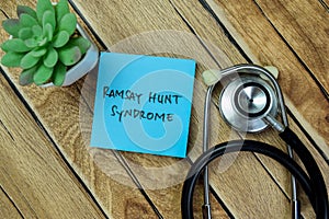 Concept of Ramsay Hunt Syndrome write on sticky notes isolated on Wooden Table photo