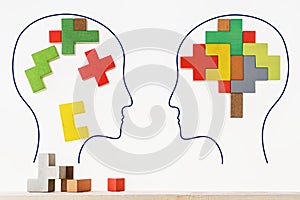 The concept of rational and irrational thinking of two people. Heads of two people with colourful shapes of abstract brain for con