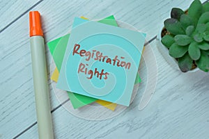 Concept of Registration Rights write on sticky notes isolated on Wooden Table