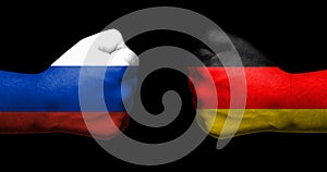 Concept of relations/conflict between Germany and Russia symbolized by two opposed clenched fists