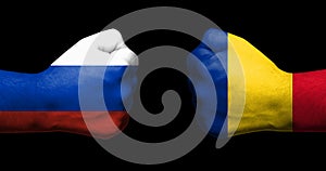 Concept of relations/conflict between Romania and Russia symbolized by two opposed clenched fists
