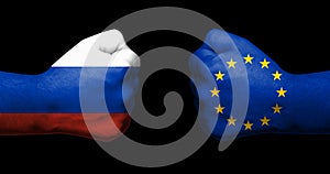 Concept of relations/conflict between Russia and the European Union symbolised by two opossed clenched fists